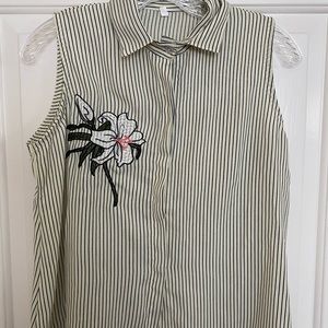 Sleeveless button-down top. Never used. Fits XS-S.